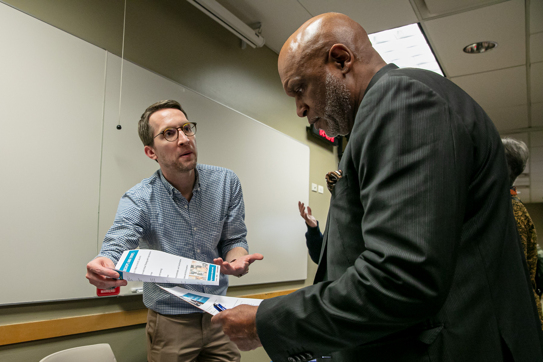 Daniel Stanford, director of faculty development in the Center for Teaching and Learning, presents information regarding teaching development seminars to adjunct faculty. (DePaul University/Randall Spriggs)